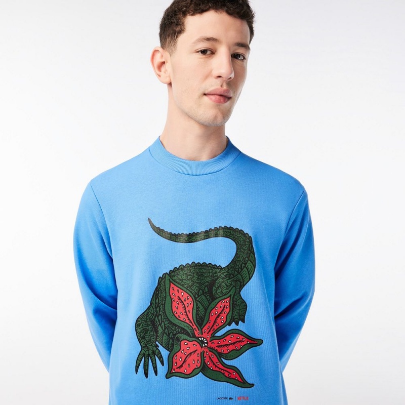 Men's Lacoste Lacoste x Netflix Organic Cotton Fleece Print Sweatshirt Ethereal blue | LBT273591