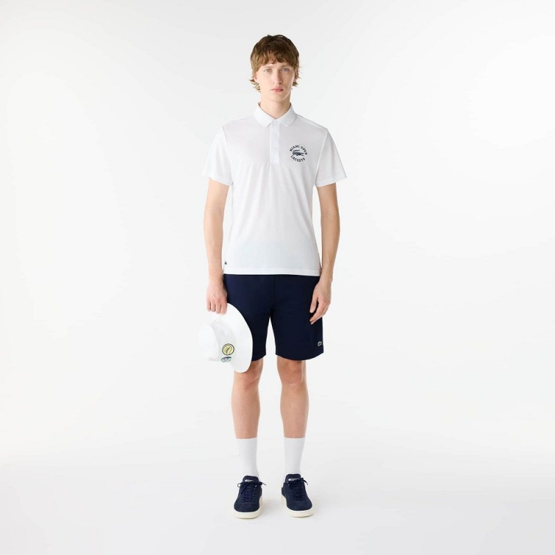 Men's Lacoste Miami Open Edition Ultra-Dry Piqué Polo Shirts White | OYC348196